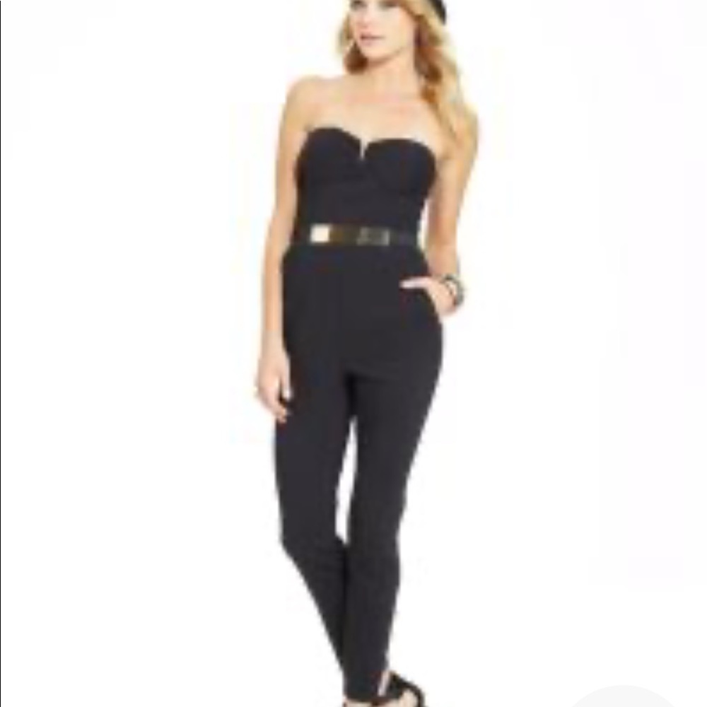 Black jumpsuit with gold belt.